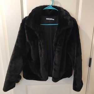 Francesca’s black fuzzy coat